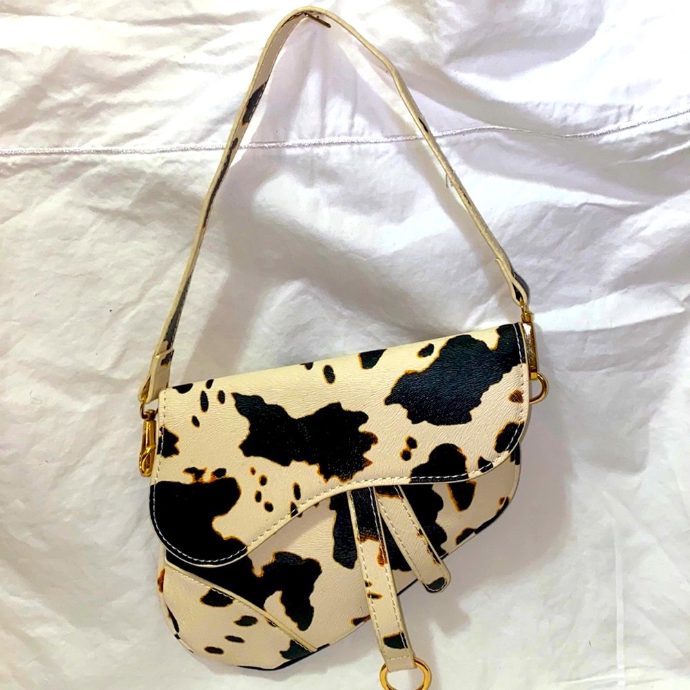 Cow print saddle purse